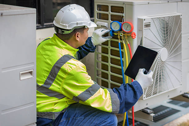 Professional Hvac technician working in Norton, MA